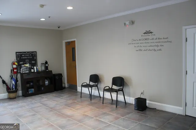 a room with lots of furniture and a wooden floor