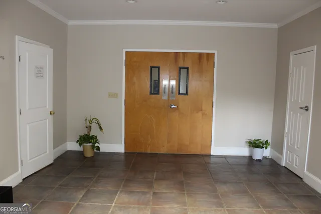 a view of a hallway with closet