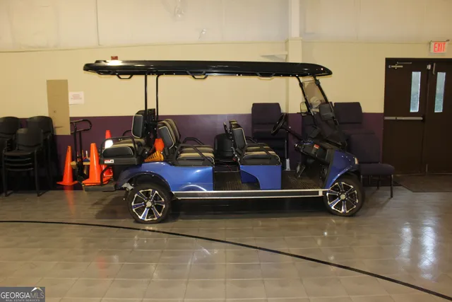 a view of workspace room with furniture and window