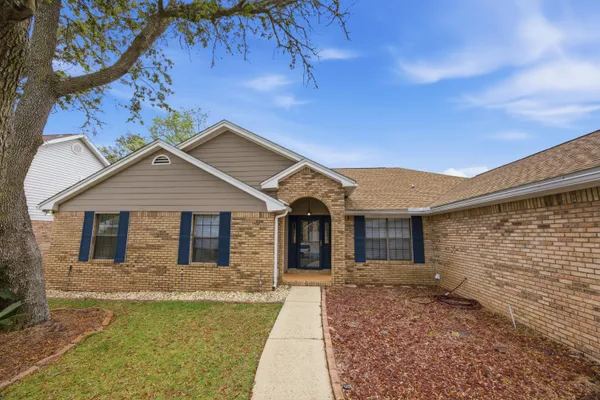 a living room with furniture potted plant and a window