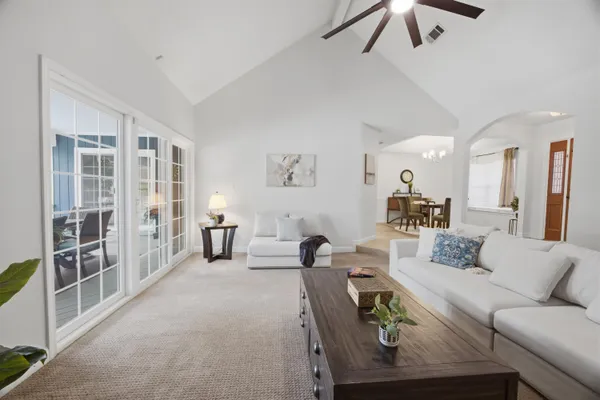 a bathroom with a granite countertop sink a large mirror and a shower