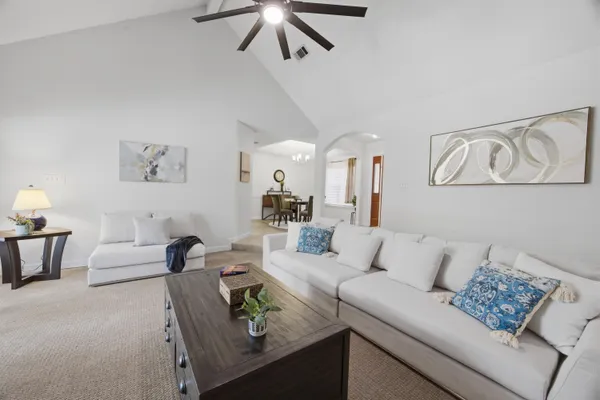 a bathroom with a granite countertop sink a toilet and bathtub
