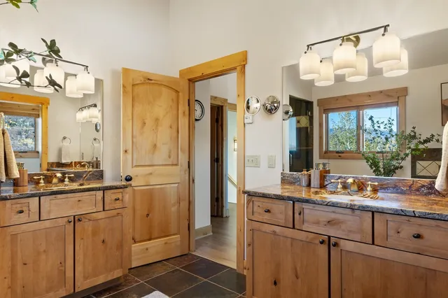 a room with stainless steel appliances a sink and a large window