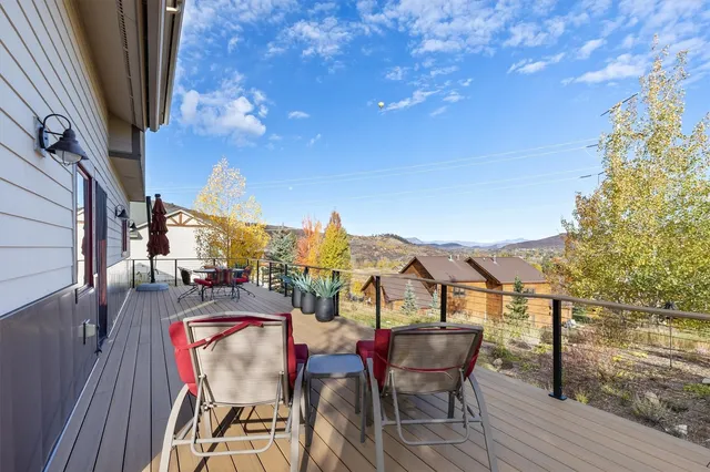 a view of a chairs and table on the balcony