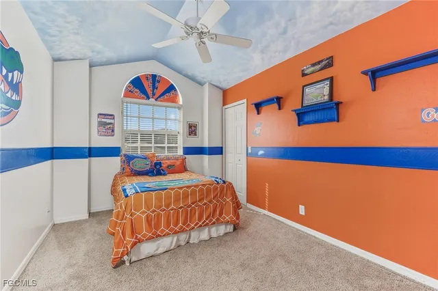 a bedroom with a bed and lamp