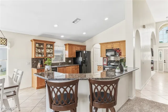 a living room with furniture a rug and a table