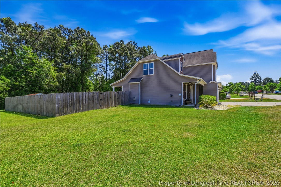 140 Birch Avenue Spring Lake, NC 28390 - Photo 5 of 49 a view of a back yard of the house