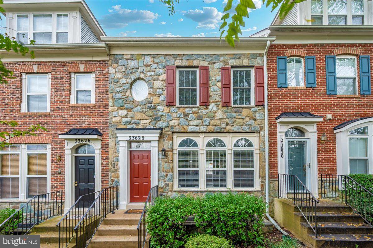 front view of a brick building with a large windows