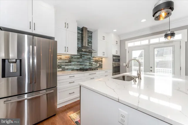 a kitchen with refrigerator and window