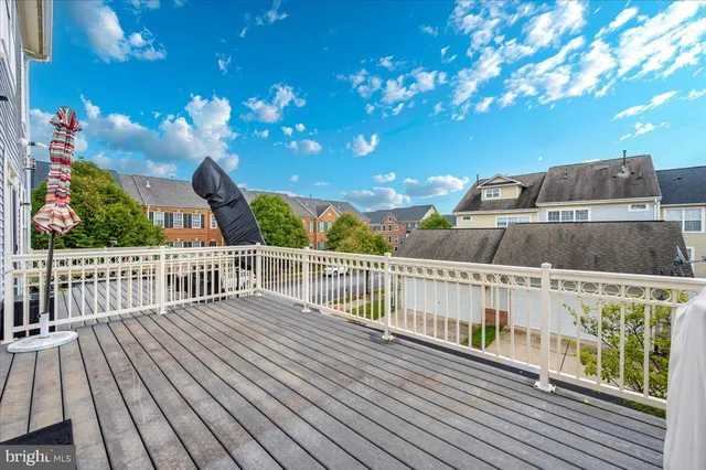 a view of balcony with wooden floor