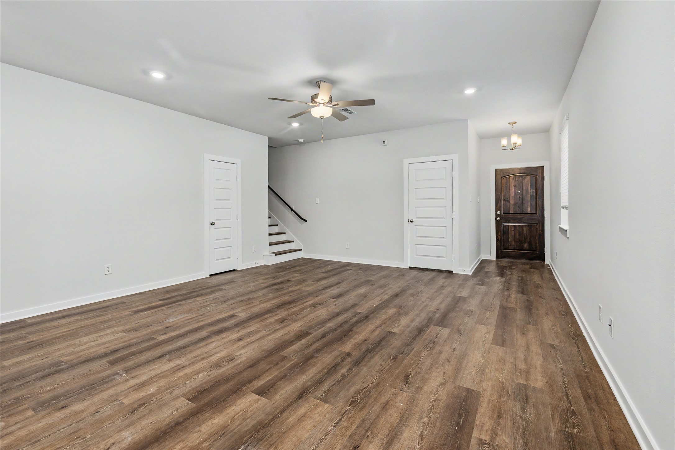 6423 Bolinas Court Rosharon, TX 77583 - Photo 7 of 39 wooden floor in an empty room with a window