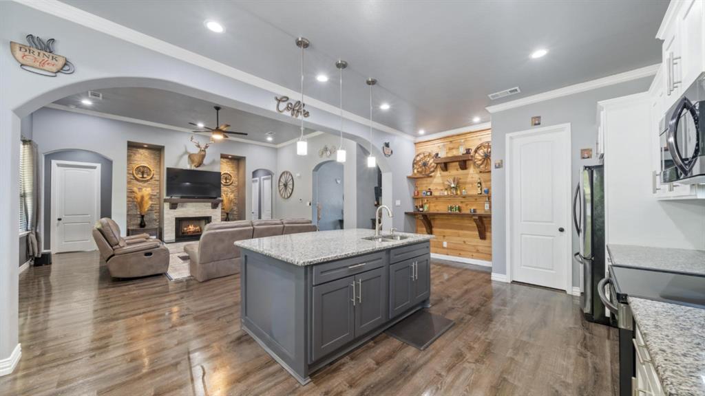 401 May Road Seagoville, TX 75159 - Photo 13 of 31 a large white kitchen with a large island in the center