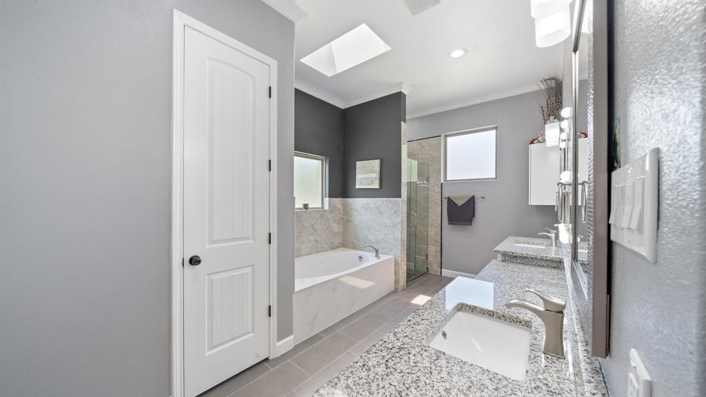 401 May Road Seagoville, TX 75159 - Photo 18 of 31 a bathroom with a tub shower and view of living room