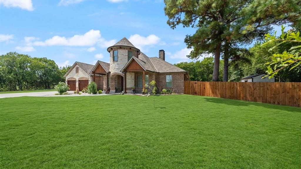 401 May Road Seagoville, TX 75159 - Photo 2 of 31 a front view of a house with garden