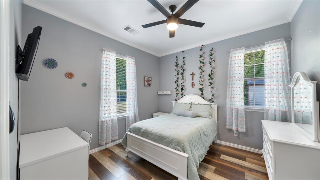 401 May Road Seagoville, TX 75159 - Photo 21 of 31 a bedroom with a large bed and a window
