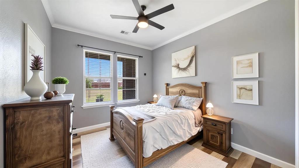 401 May Road Seagoville, TX 75159 - Photo 24 of 31 a bedroom with a bed dresser and a window