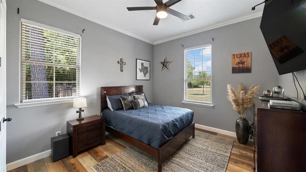 401 May Road Seagoville, TX 75159 - Photo 25 of 31 a bedroom with a bed and wooden floor