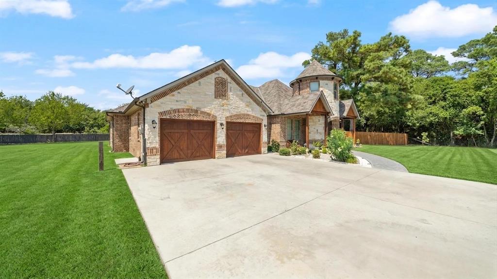 401 May Road Seagoville, TX 75159 - Photo 3 of 31 a front view of a house with a garden and yard