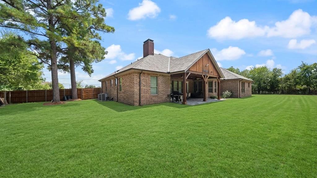 401 May Road Seagoville, TX 75159 - Photo 4 of 31 a view of a house with backyard and garden