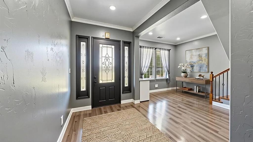 401 May Road Seagoville, TX 75159 - Photo 6 of 31 a bedroom with a bed large window and a chandelier