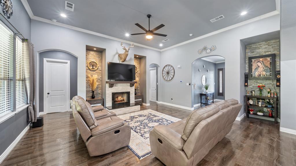 401 May Road Seagoville, TX 75159 - Photo 10 of 31 a living room with furniture a large window and a flat screen tv