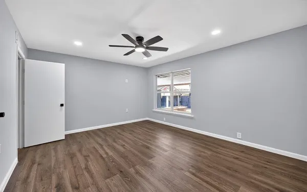 a bathroom with a toilet a sink and a mirror