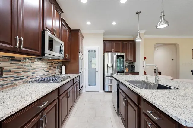 a large kitchen with granite countertop lots of counter space