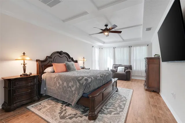 a bed room with a bed and a television