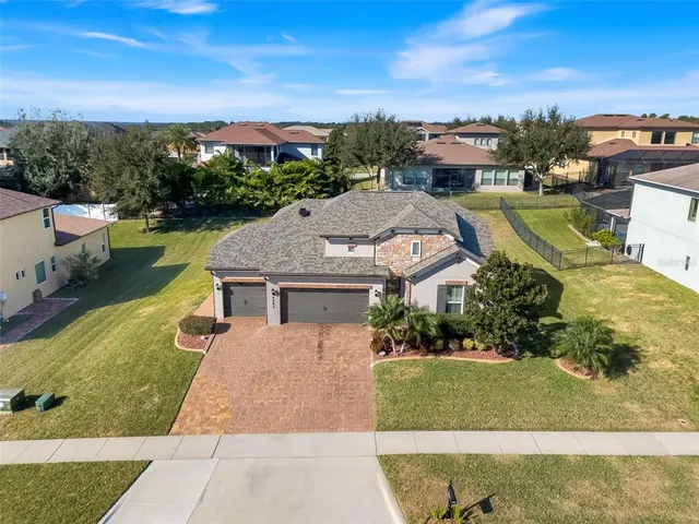 an aerial view of a house with a garden