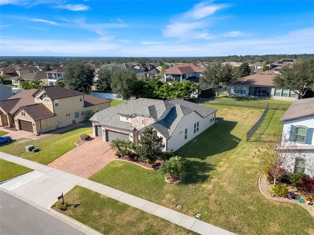 an aerial view of a house with a garden