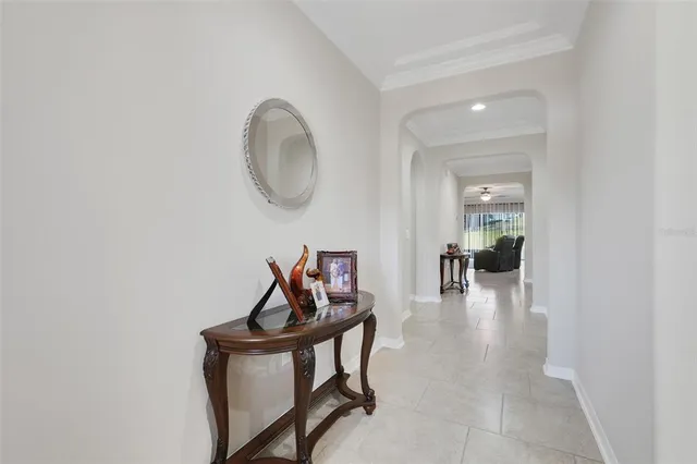 a view of a room with furniture and wooden floor
