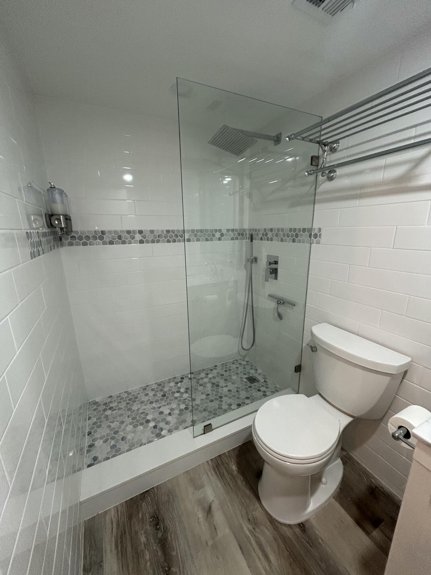4511 South Ocean Boulevard, Unit 204 Highland Beach, FL 33487 - Photo 13 of 19 a bathroom with a toilet and a shower