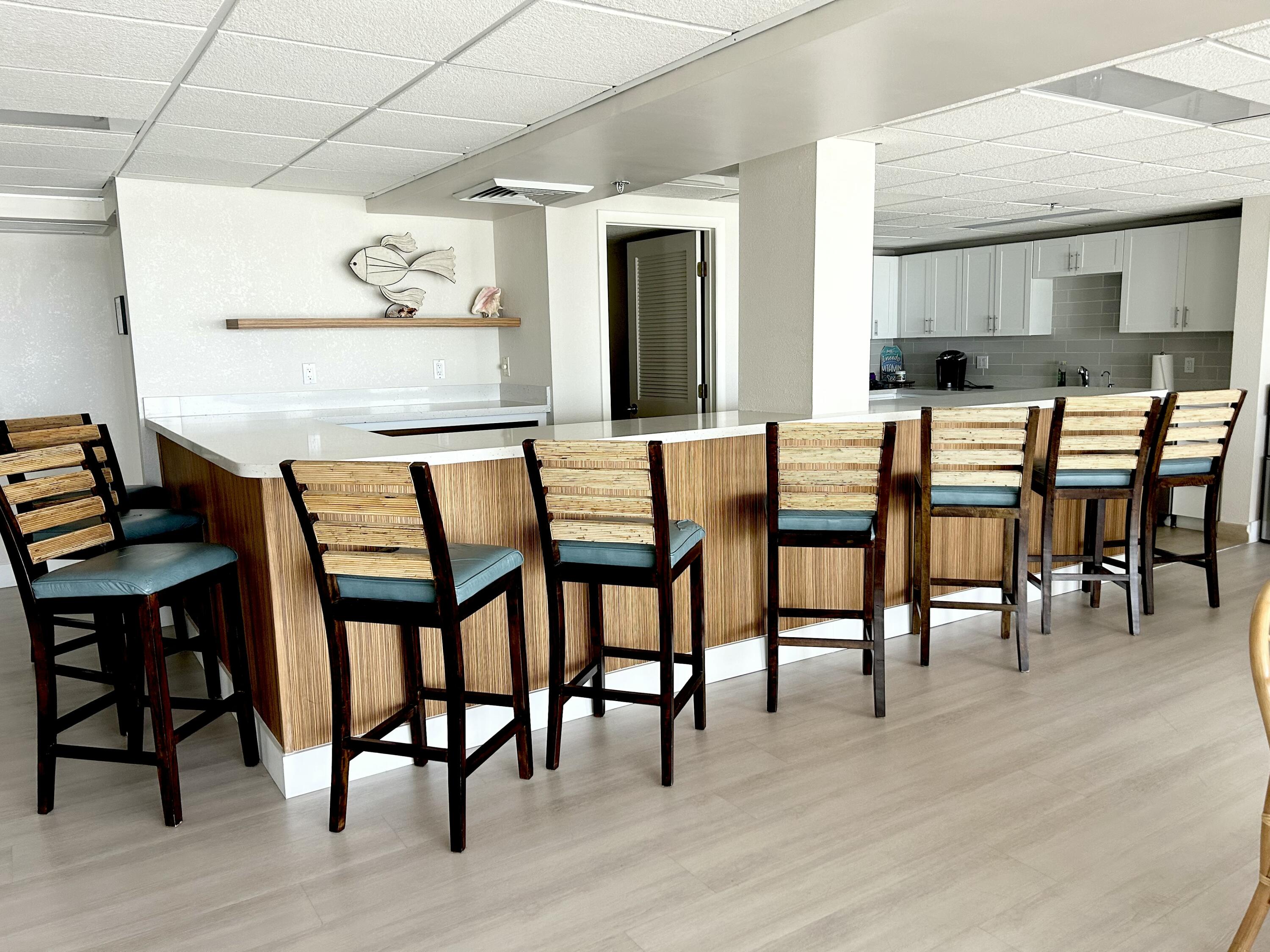 4511 South Ocean Boulevard, Unit 204 Highland Beach, FL 33487 - Photo 14 of 19 a dining room with furniture and wooden floor