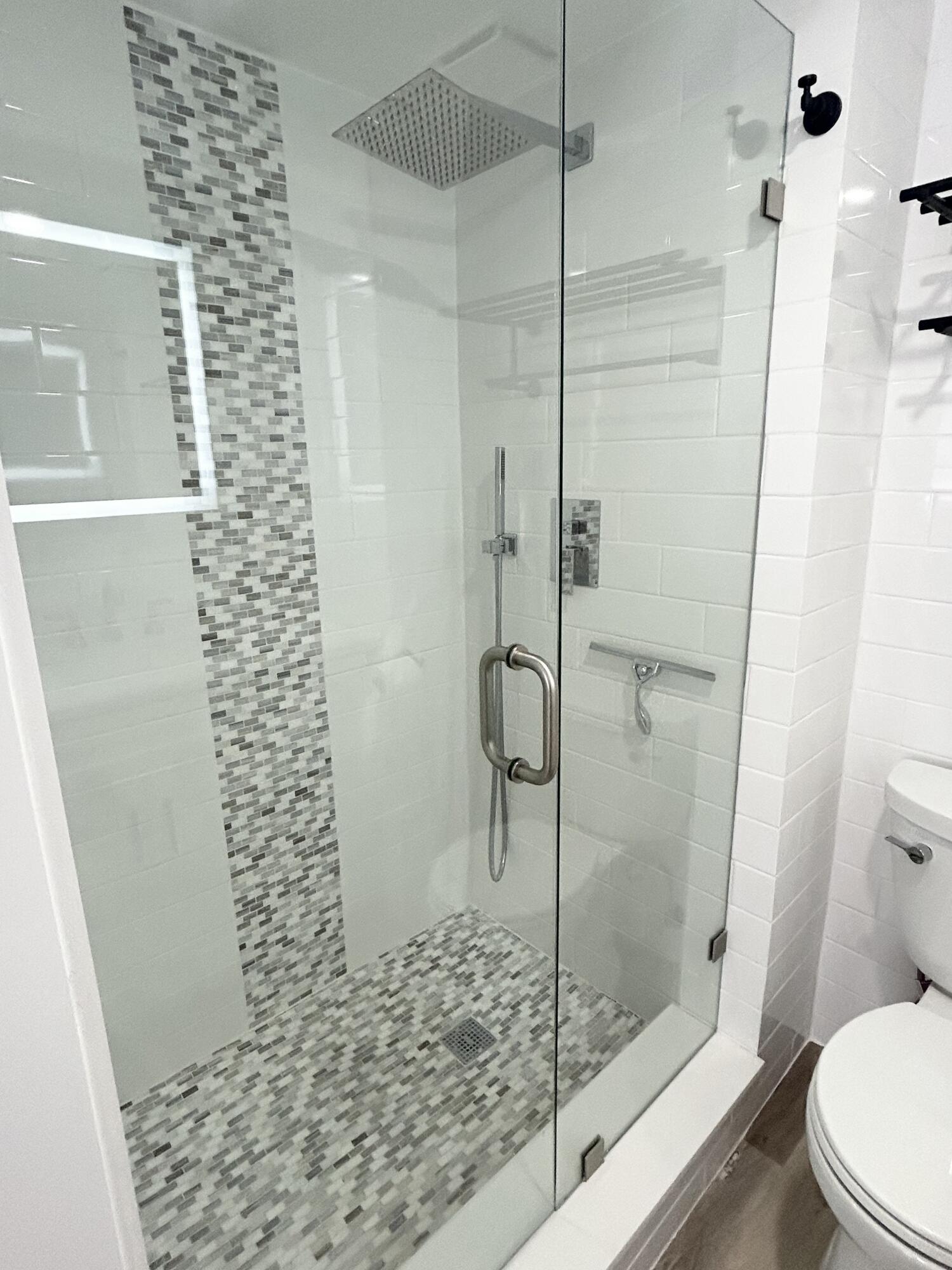 4511 South Ocean Boulevard, Unit 204 Highland Beach, FL 33487 - Photo 5 of 19 a bathroom with a shower and toilet