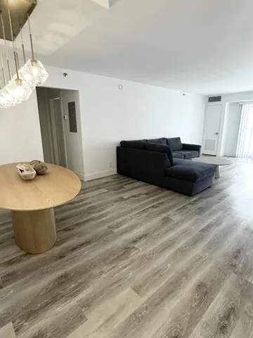 a bed room with a bed and a mirror