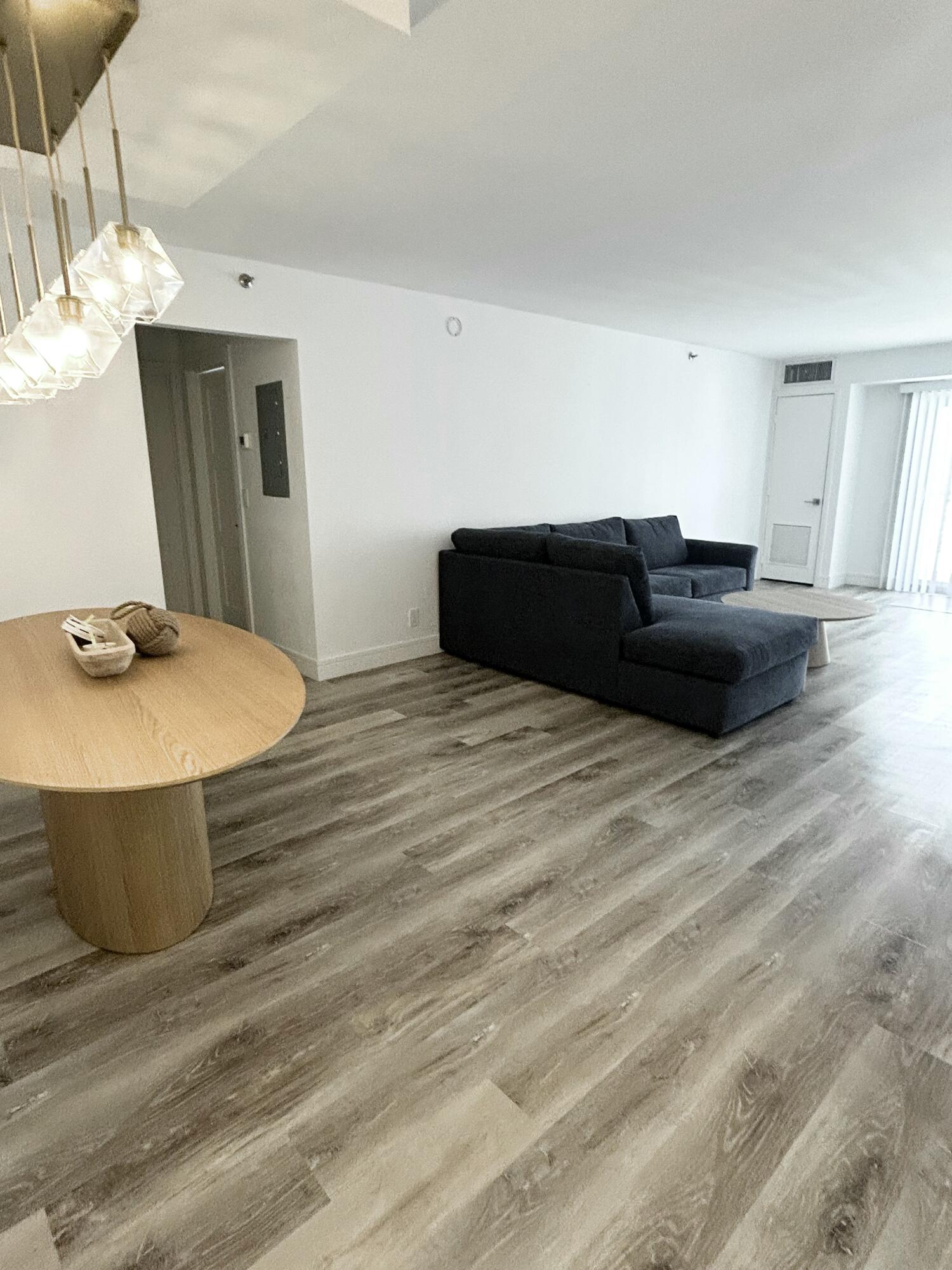 4511 South Ocean Boulevard, Unit 204 Highland Beach, FL 33487 - Photo 7 of 19 a bed room with a bed and a mirror