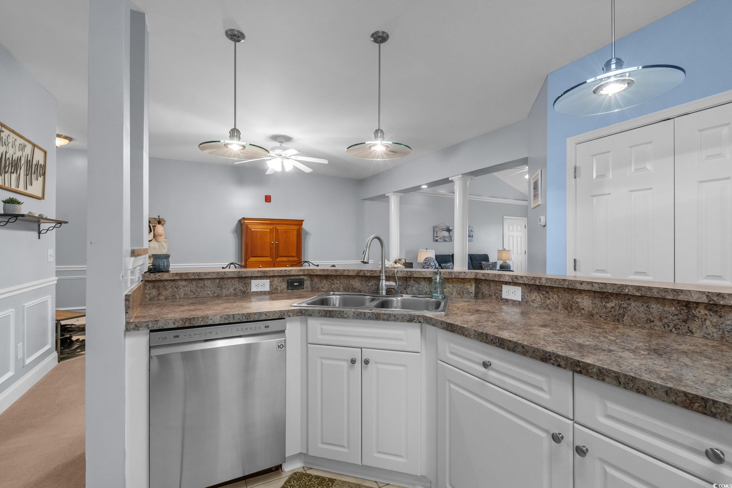 70 Addison Cottage Way, Unit 322 Murrells Inlet, SC 29576 - Photo 11 of 40 Kitchen with dishwasher, white cabinets, dark countertops, ceiling fan, and hanging light fixtures