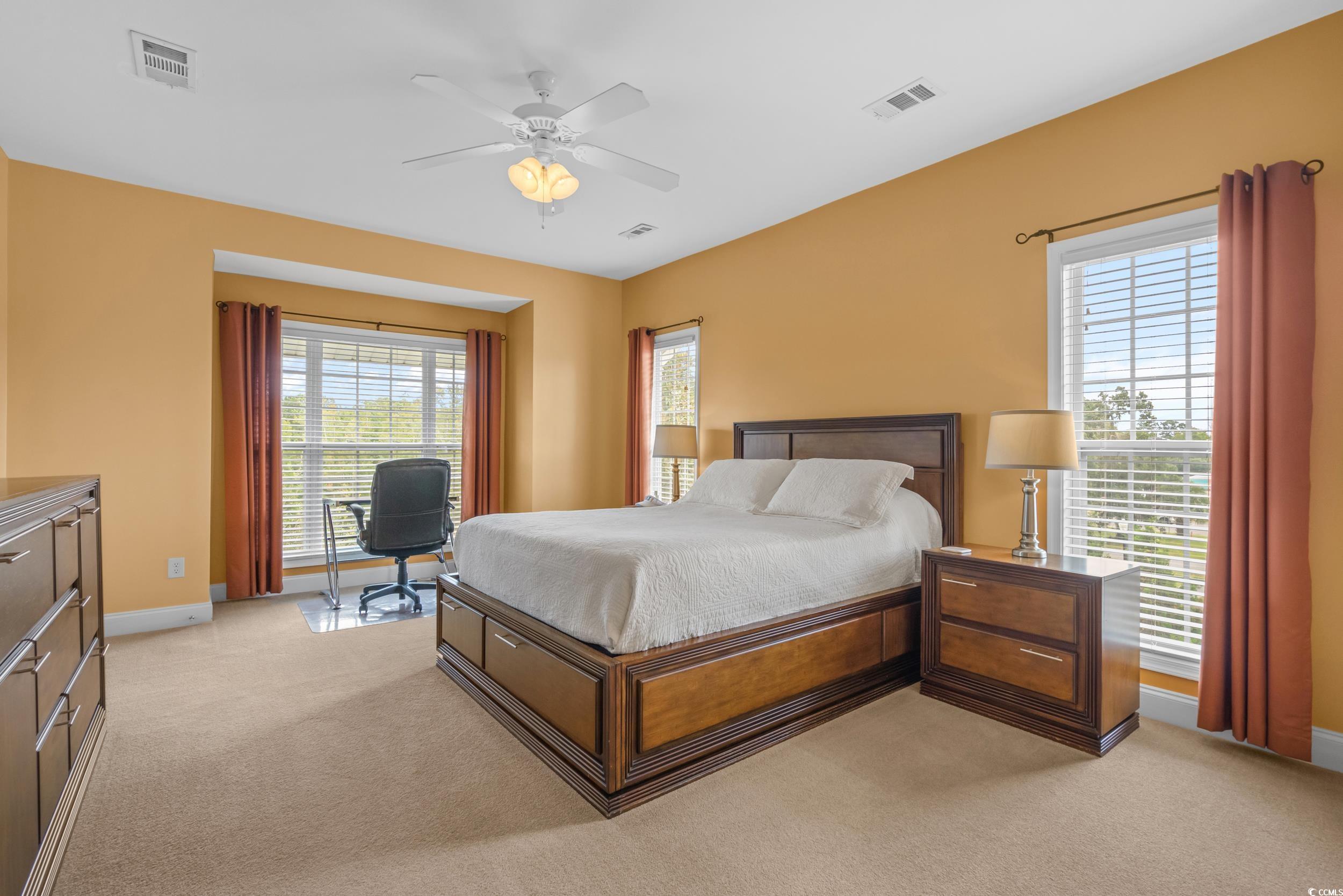 70 Addison Cottage Way, Unit 322 Murrells Inlet, SC 29576 - Photo 18 of 40 Bedroom with light colored carpet, ceiling fan, and an office area