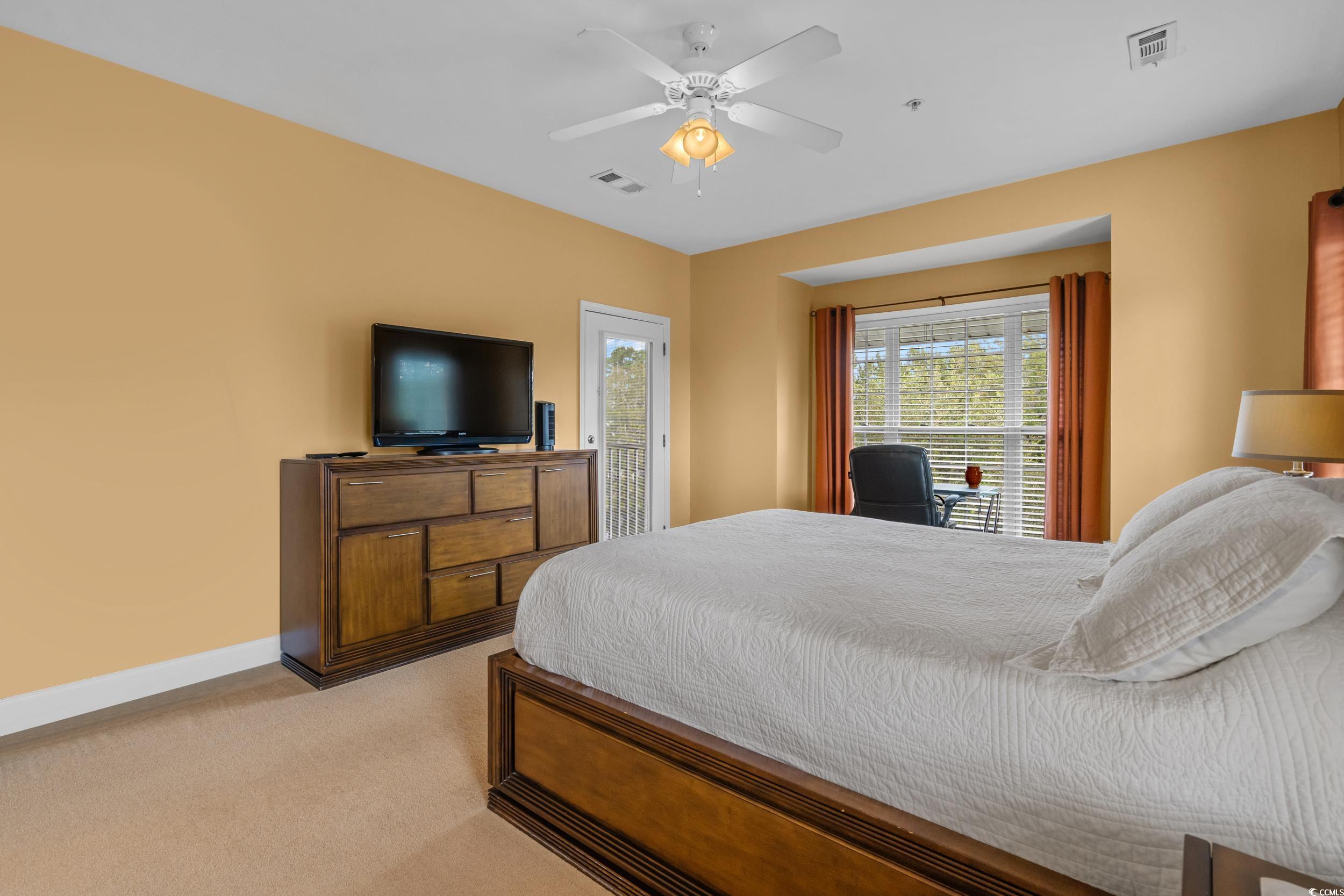 70 Addison Cottage Way, Unit 322 Murrells Inlet, SC 29576 - Photo 19 of 40 Bedroom with carpet flooring, ceiling fan, and access to outside