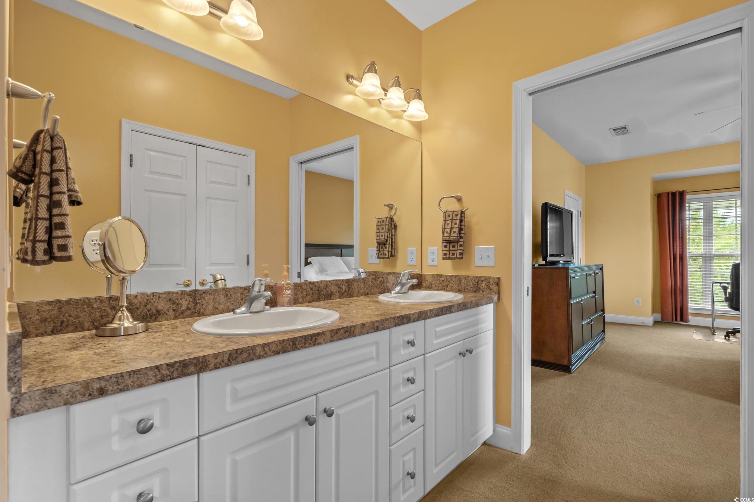 70 Addison Cottage Way, Unit 322 Murrells Inlet, SC 29576 - Photo 20 of 40 Full bathroom featuring double vanity and baseboards