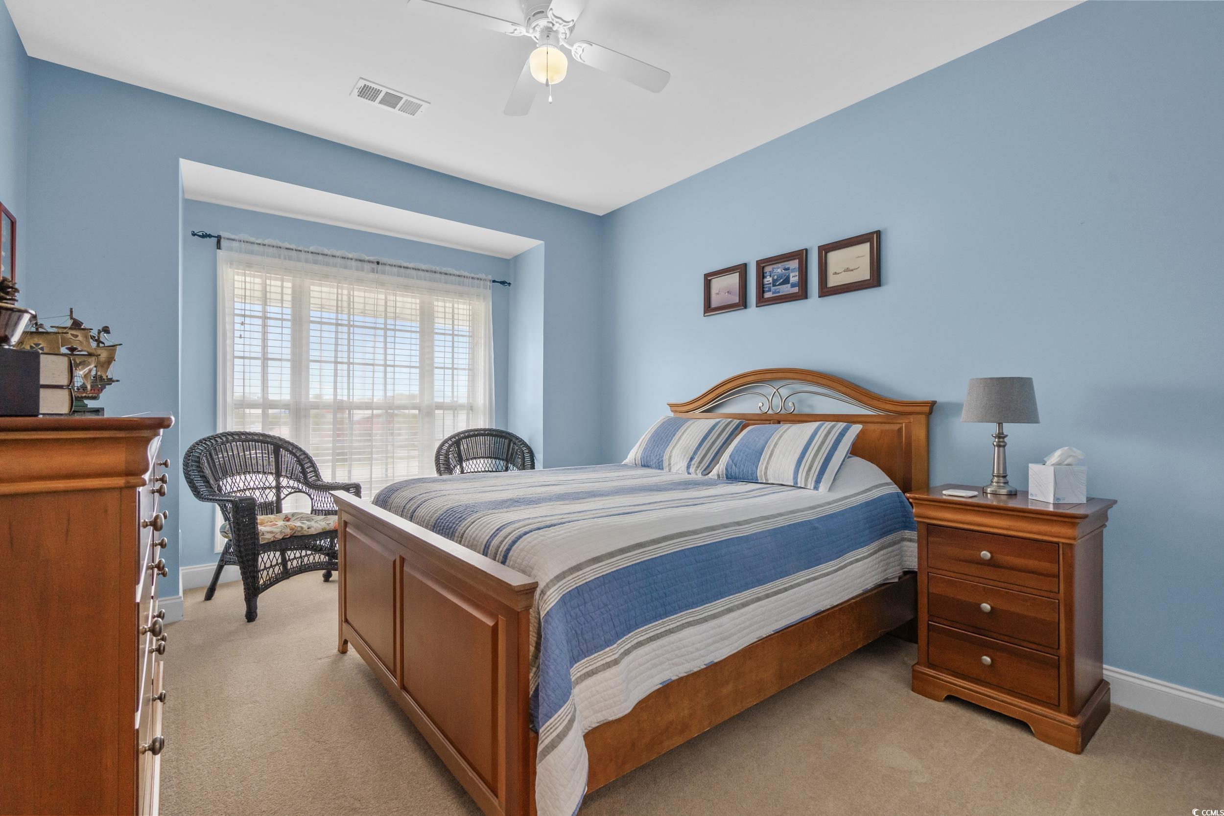 70 Addison Cottage Way, Unit 322 Murrells Inlet, SC 29576 - Photo 25 of 40 Bedroom with light colored carpet and a ceiling fan