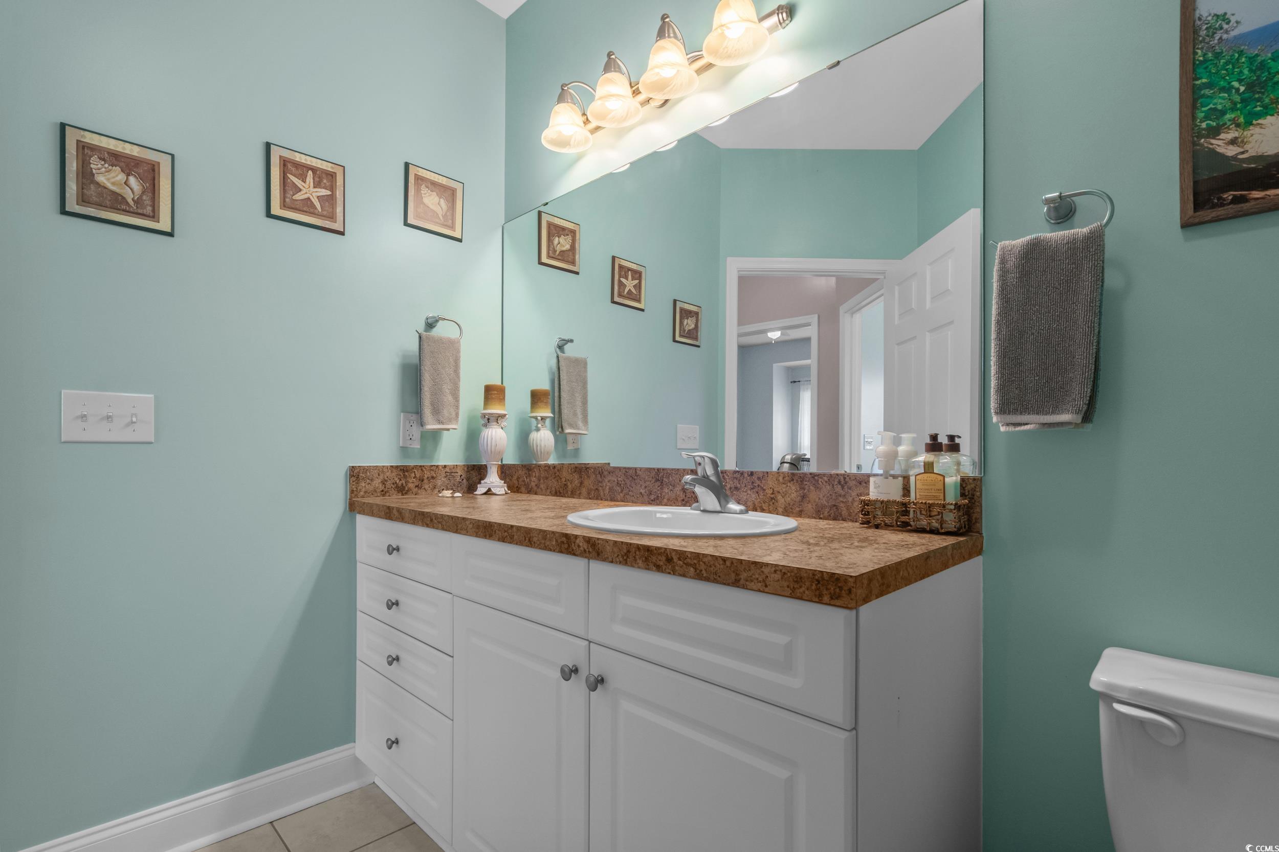 70 Addison Cottage Way, Unit 322 Murrells Inlet, SC 29576 - Photo 26 of 40 Half bath featuring vanity and light tile patterned flooring