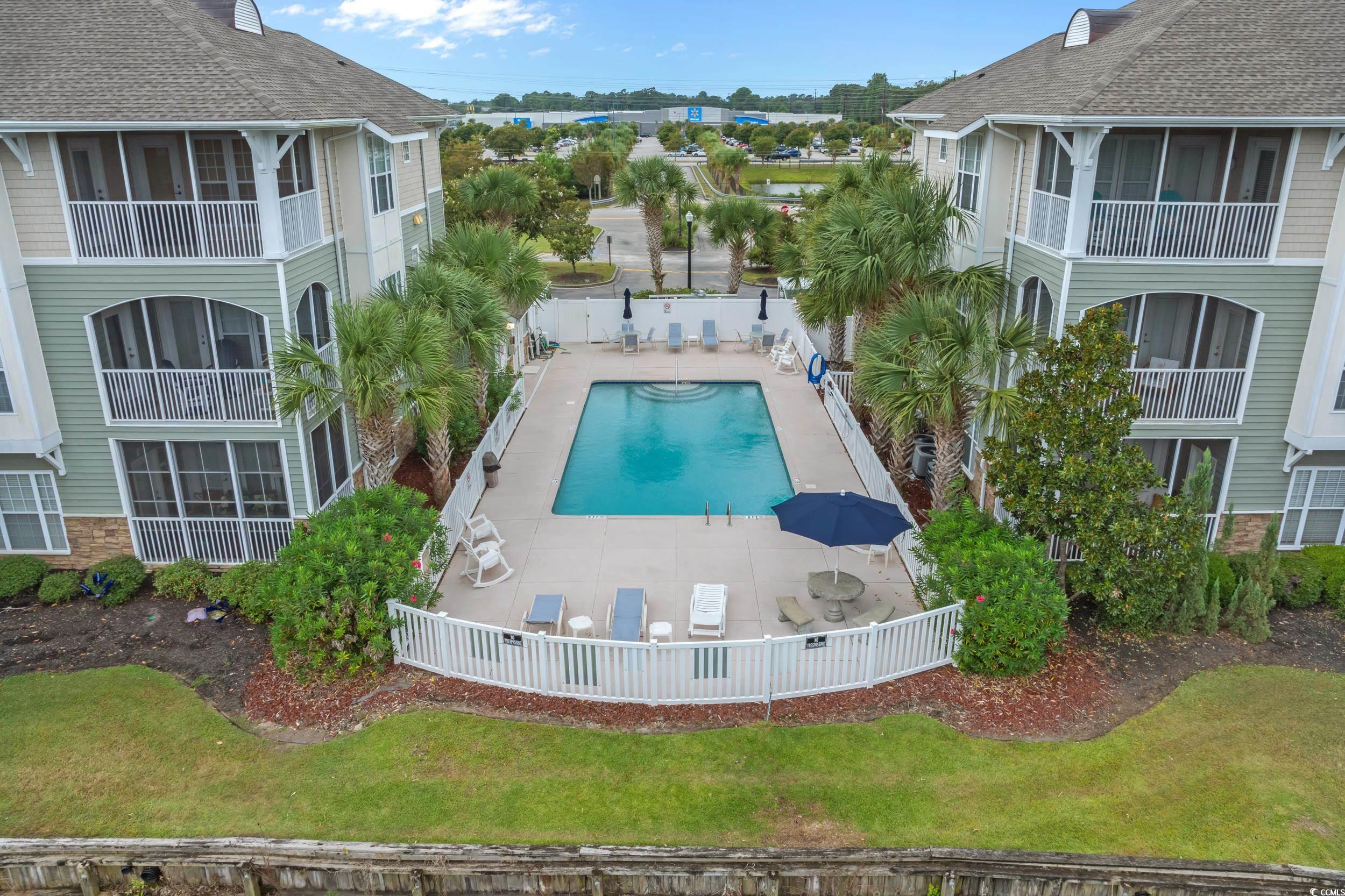 70 Addison Cottage Way, Unit 322 Murrells Inlet, SC 29576 - Photo 30 of 40 Community pool featuring a balcony