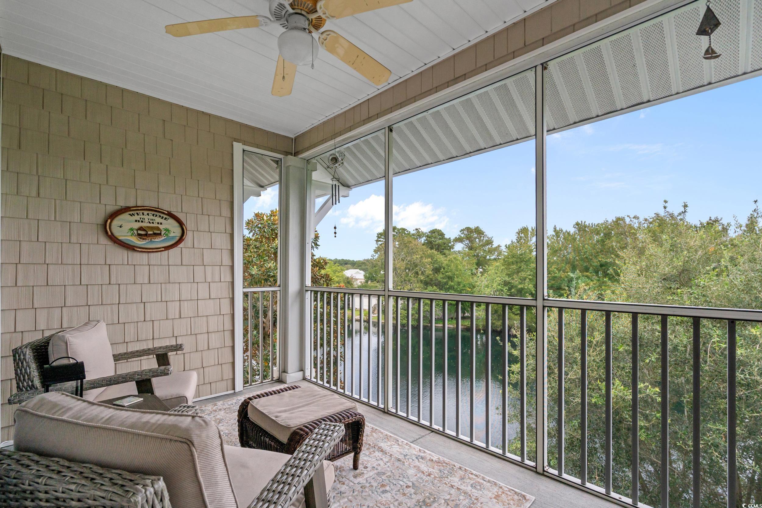 70 Addison Cottage Way, Unit 322 Murrells Inlet, SC 29576 - Photo 3 of 40 Sunroom / solarium featuring ceiling fan, a balcony, and a water view