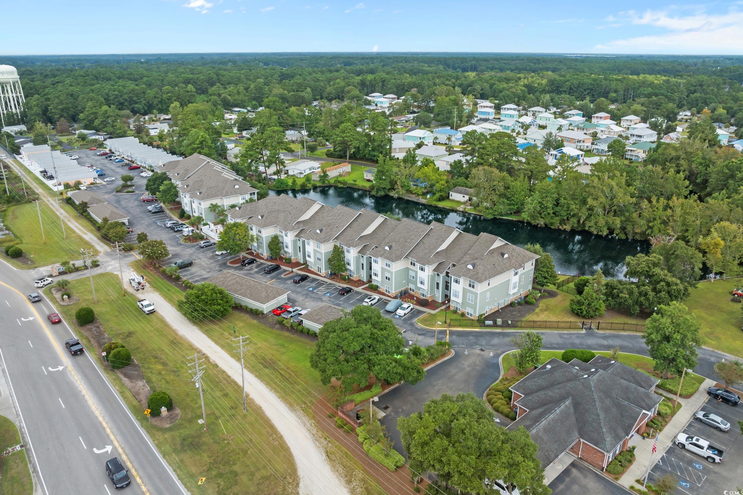 70 Addison Cottage Way, Unit 322 Murrells Inlet, SC 29576 - Photo 35 of 40 Aerial overview of property's location with a nearby body of water and nearby suburban area