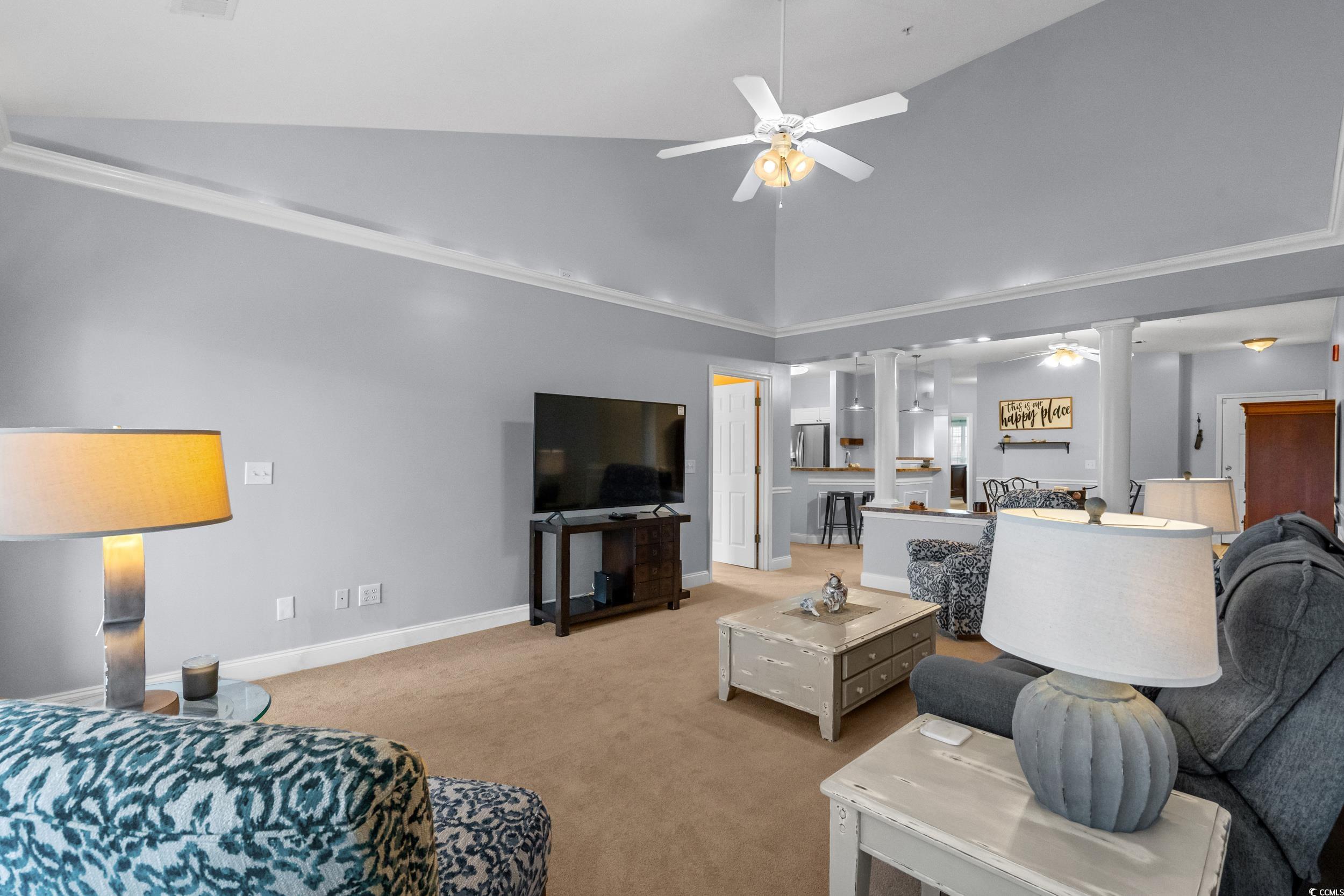 70 Addison Cottage Way, Unit 322 Murrells Inlet, SC 29576 - Photo 8 of 40 Carpeted living room with a ceiling fan, ornate columns, and high vaulted ceiling