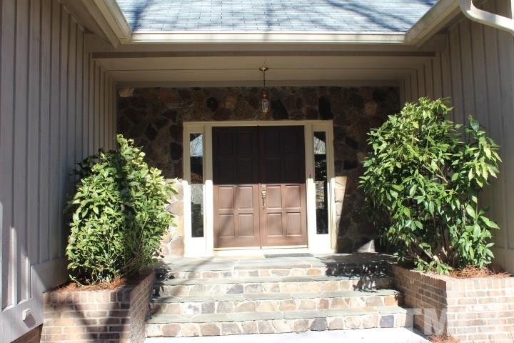 10700 Dunhill Terrace Raleigh, NC 27615 - Photo 2 of 16 a front view of a house with garden