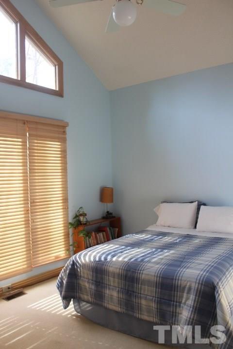 10700 Dunhill Terrace Raleigh, NC 27615 - Photo 11 of 16 a bedroom with a bed and window