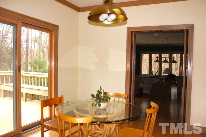 10700 Dunhill Terrace Raleigh, NC 27615 - Photo 8 of 16 a view of a dining room with furniture window and wooden floor