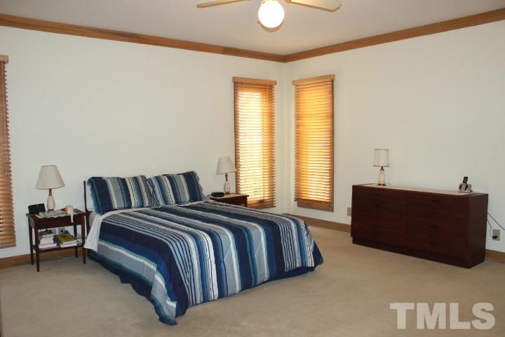 10700 Dunhill Terrace Raleigh, NC 27615 - Photo 9 of 16 a spacious bedroom with a bed and window